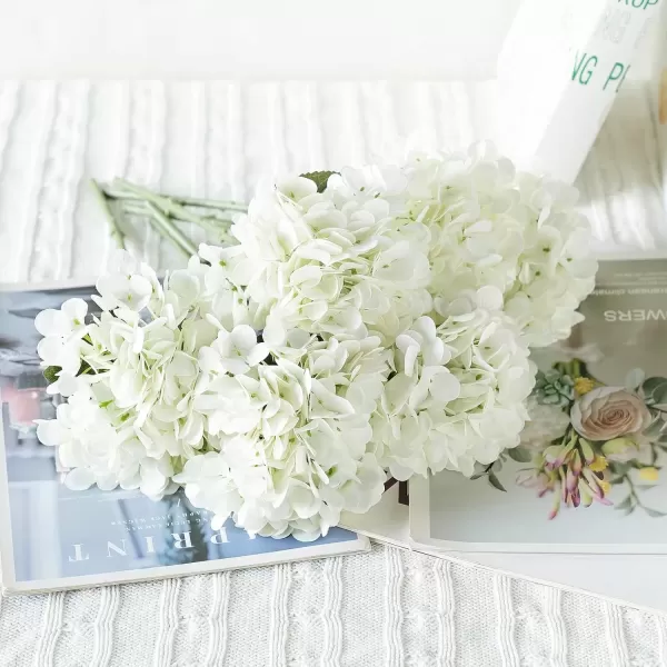 imageMkono 6 Pack Artificial Hydrangea White Fake Folwers with Long Stem and Leaves Faux Floral Real Touch Decorative Flowers for Home Decor Wedding Party Decorations White