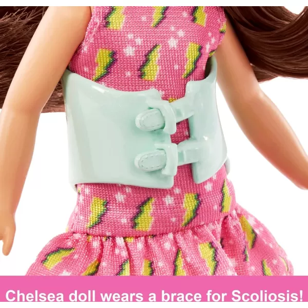 Barbie Chelsea Doll Small Doll with Brace for Scoliosis Spine Curvature Brunette Wearing Pink Lightning Bolt DressBarbie Chelsea Doll Small Doll with Brace for Scoliosis Spine Curvature Brunette Wearing Pink Lightning Bolt Dress