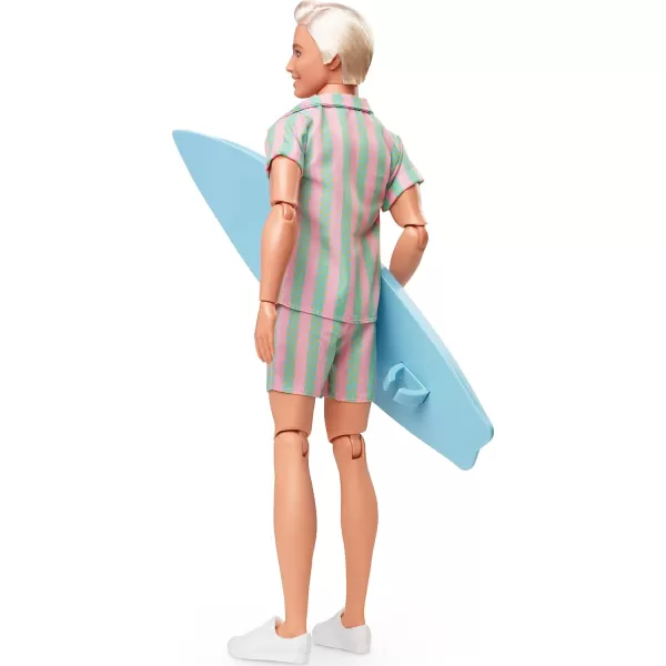 Barbie The Movie Ken Doll Wearing Pastel Pink and Green Striped Beach Matching Set with Surfboard and White SneakersBarbie The Movie Ken Doll Wearing Pastel Pink and Green Striped Beach Matching Set with Surfboard and White Sneakers