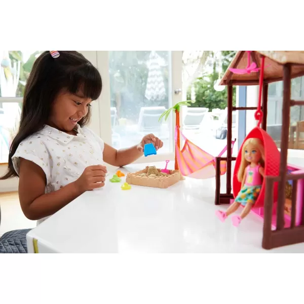 imageBarbie Dreamhouse Adventures Chelsea Doll ampamp Tiki Hut Playset with Moldable Sand Hammock ampamp Accessories Blonde Small Doll