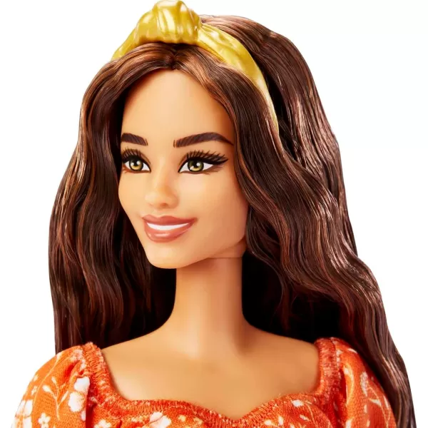 imageBarbie Fashionistas Doll 182 with Long Wavy Brunette Hair Orange Floral Print Dress ampamp Accessories Including Headband ampamp Heels