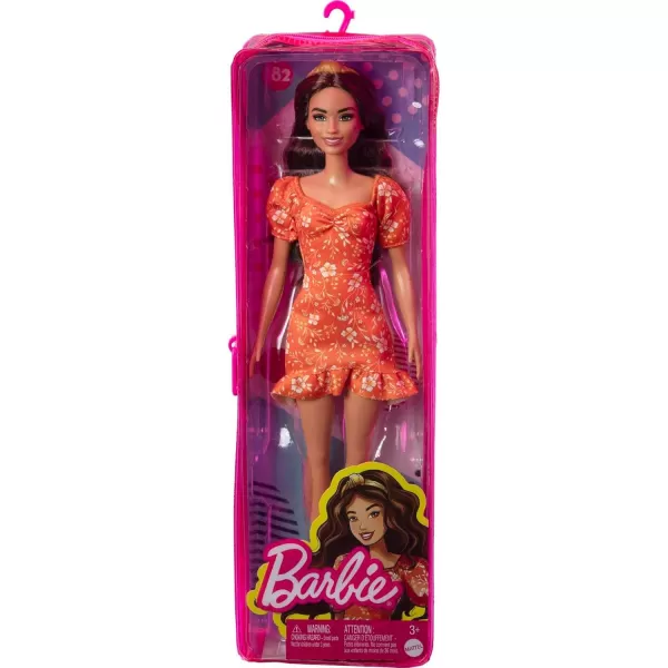 imageBarbie Fashionistas Doll 182 with Long Wavy Brunette Hair Orange Floral Print Dress ampamp Accessories Including Headband ampamp Heels