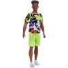 imageBarbie Fashionistas Ken Doll 123 Broad with Black Curly Hair Wearing MultiColored Camo Print Shirt Neon Green Shorts ampamp Silvery Sneakers