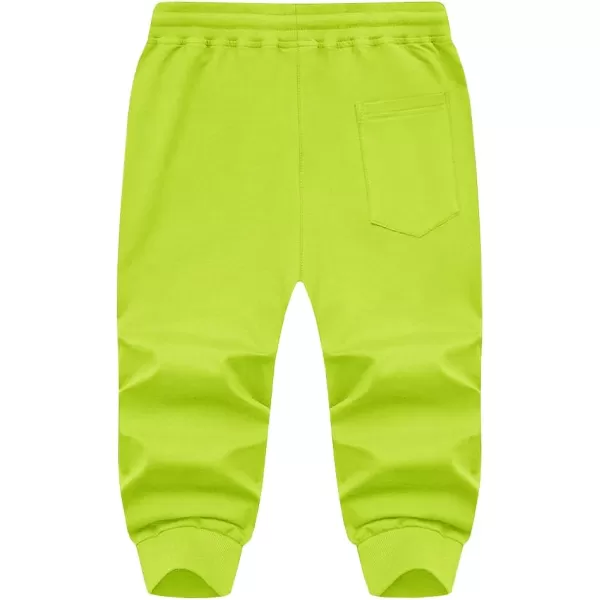 imageMAGNIVIT Mens 34 Jogger Capri Pants Workout Gym Below Knee Shorts Zipper Pockets Jogger Sweatpant Capris for MenFluorescent Green