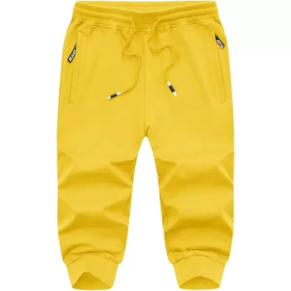 imageMAGNIVIT Mens 34 Jogger Capri Pants Workout Gym Below Knee Shorts Zipper Pockets Jogger Sweatpant Capris for MenLight Yellow