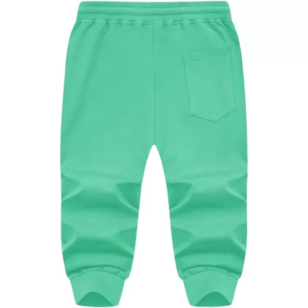 imageMAGNIVIT Mens 34 Jogger Capri Pants Workout Gym Below Knee Shorts Zipper Pockets Jogger Sweatpant Capris for MenMint Green