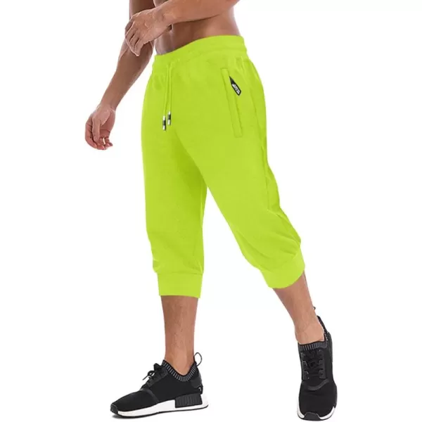 imageMAGNIVIT Mens 34 Jogger Capri Pants Workout Gym Below Knee Shorts Zipper Pockets Jogger Sweatpant Capris for MenFluorescent Green