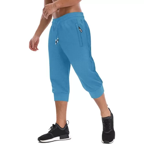 imageMAGNIVIT Mens 34 Jogger Capri Pants Workout Gym Below Knee Shorts Zipper Pockets Jogger Sweatpant Capris for MenIce Blue