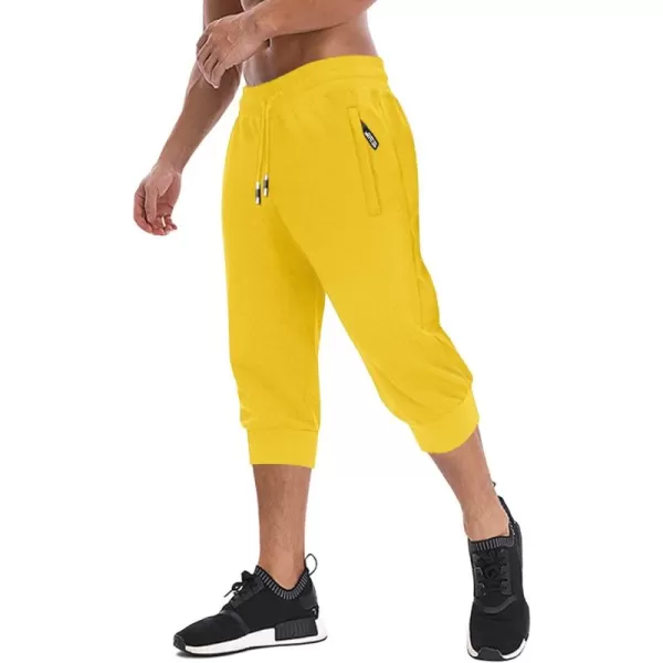 imageMAGNIVIT Mens 34 Jogger Capri Pants Workout Gym Below Knee Shorts Zipper Pockets Jogger Sweatpant Capris for MenLight Yellow