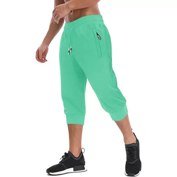 imageMAGNIVIT Mens 34 Jogger Capri Pants Workout Gym Below Knee Shorts Zipper Pockets Jogger Sweatpant Capris for MenMint Green